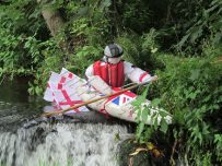 The 2012 Dalston scarecrow festival - Canoeing down the mill stream
