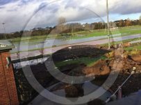 Gravel, water and debris litter the running track at the Sheepmount, Carlisle