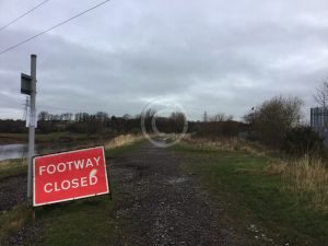 A simple path closed sign advises of problems ahead